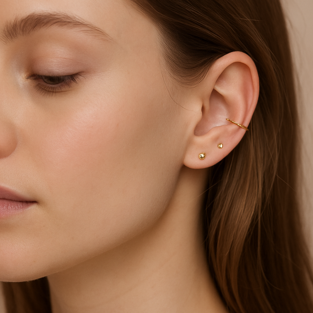 Elegant ear piercings with gold studs